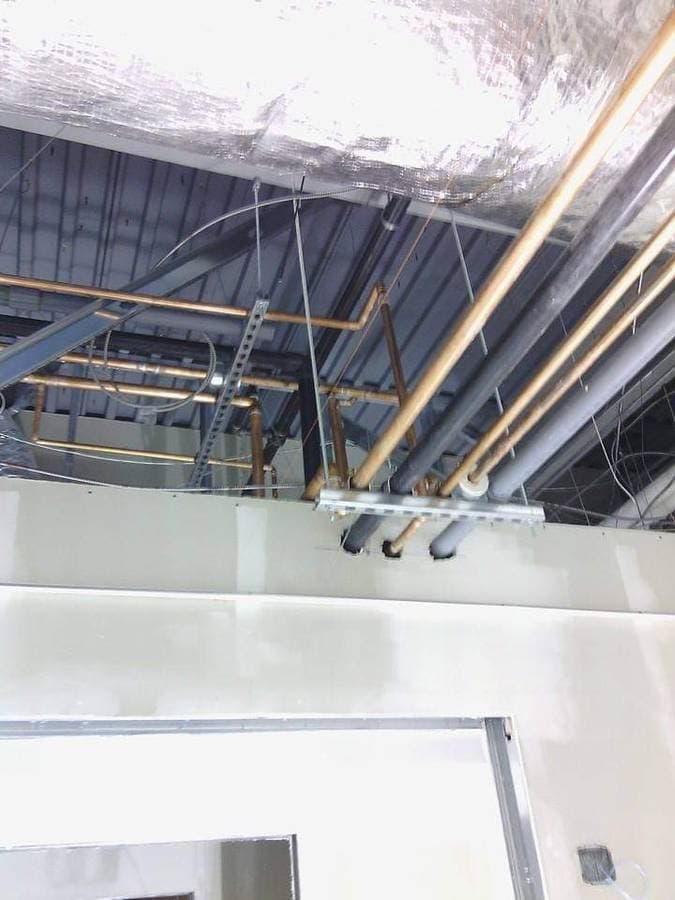 picture of plumbing being installed on a commercial property