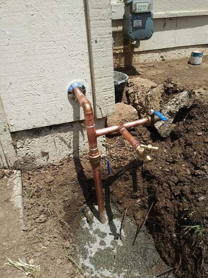 picture of an exterior copper waterline being installed in a home